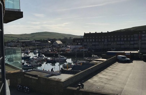 West Bay Apartment | Beachside, stunning apartment with sea and harbour views
