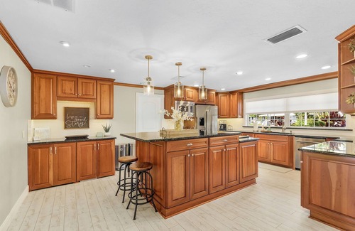 Pelican House | Beautiful, 3400 sqft,1.5 story, 4 bedroom, 4 bth. Waterfront w/large tiki bar