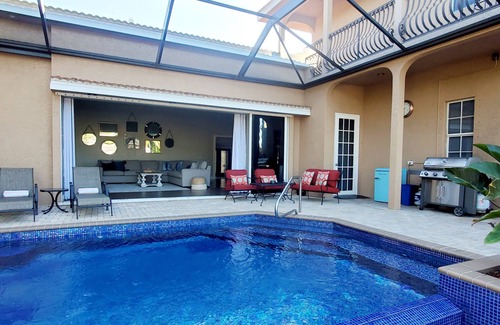 Pelican House | Beautiful, 3400 sqft,1.5 story, 4 bedroom, 4 bth. Waterfront w/large tiki bar