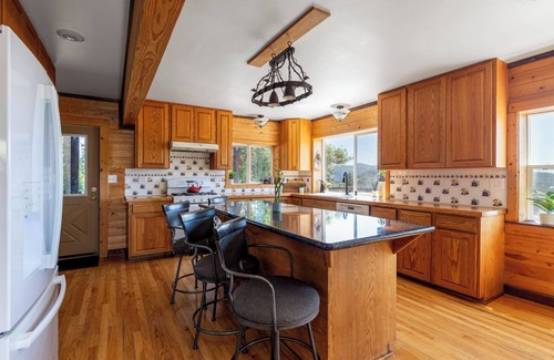 Kettle Falls House | Beautiful 5-bedroom log home with spacious rooms and rustic charm.