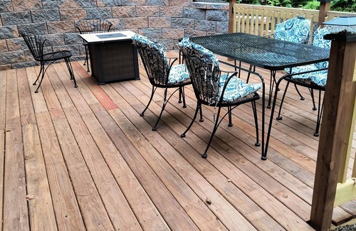 Shore House | Beautiful cabin situated on wooded land with nice yard clearing and small stream