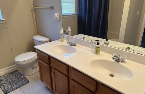 Charlotte House | Beautiful end unit vacation home for short term rental with adequate sunlight.