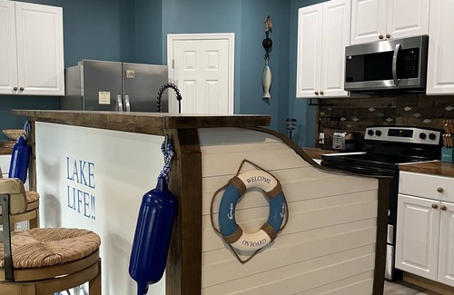 Dandridge House | Beautiful new construction lake themed lake house with gameroom and boat bar.
