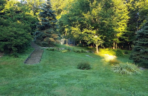 Redding Ridge Apartment | Bedroom, bathroom with beautiful shower, second room with work or eating area.