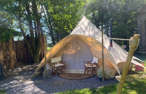 Washford Cabin | Bell tent in ultimate luxury with a wood fired hot tub, super king size bed