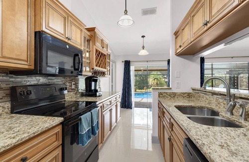 Brandon House | Blue Serenity Retreat - Come relax by the heated pool and jacuzzi!