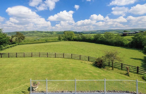 Tregaron Cottage | Boasting panoramic views, set in 15 acres, with open water lake and river.