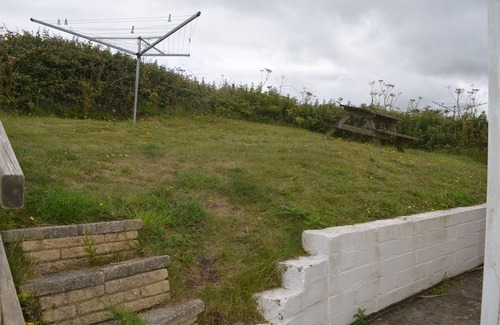 Hayle Ski Chalet | Bojago soaks up the evening sun, which can be enjoyed from an elevated rear garden. Sea Views.