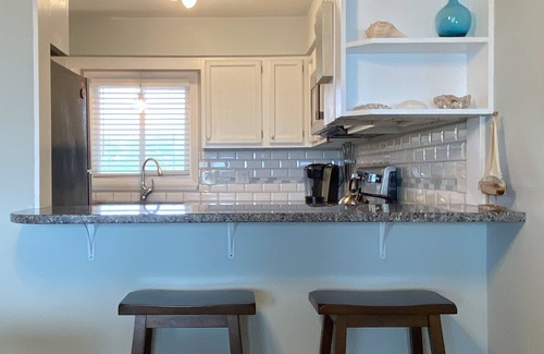 Caswell Beach Condo | Bright and Beachy Oceanfront Condo - Linens included!