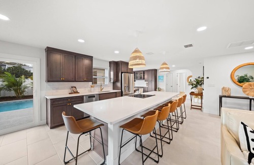 Venetian Way House | Bright and Beachy Pool Home