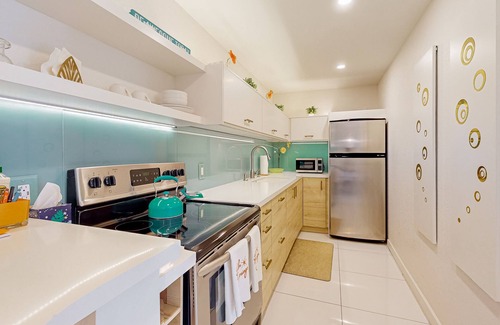 Racquet Club West Condo | Bright & modern dog-friendly oasis with pool, tennis courts, balcony, & A/C