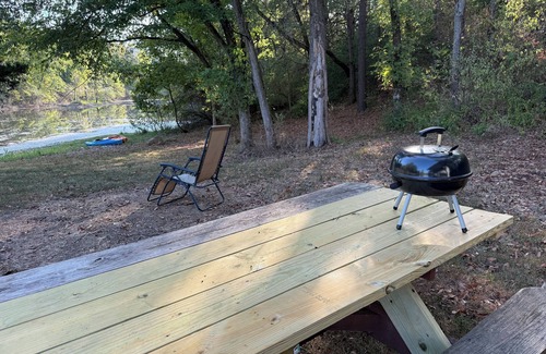 Jacob RV Rental | Camper in country setting beside water, near Burning Star Wildlife area
