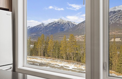 Three Sisters Mountain Village Condo | Canmore: 3BR Condo in Stewart Creek with Garage