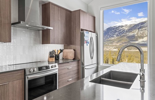 Three Sisters Mountain Village Condo | Canmore: 3BR Condo in Stewart Creek with Garage