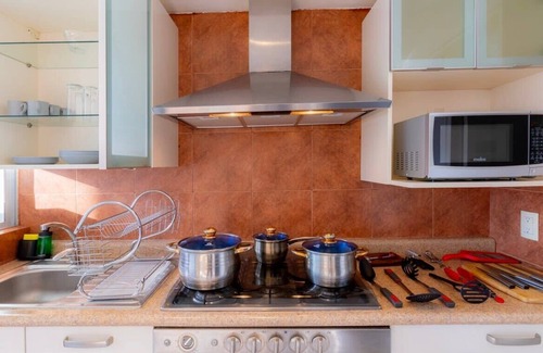 El Yaqui Condo | Capitalia - Chic Renovated w/Garden