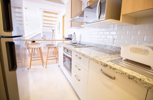 El Yaqui Condo | Capitalia - Duplex, Sleek & Modern
