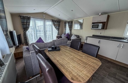 Colchester House | Caravan with large decking at Coopers Beach Holiday Park ref 49012SV