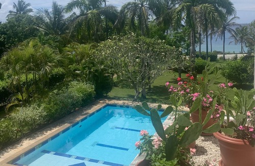 Punta Sur Villa | Casa de las flores tropical lodge in front of the sea- gardens- family- friendly