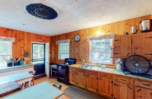 Charlotte Cottage | Century-old lakefront Victorian on a private island with boats & beach - dogs OK