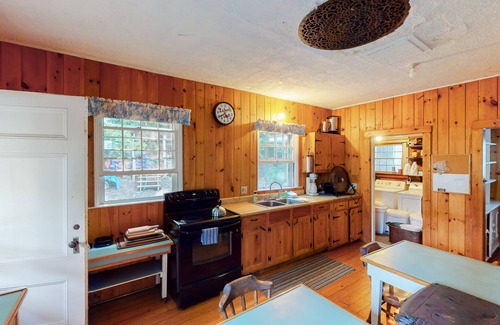 Charlotte Cottage | Century-old lakefront Victorian on a private island with boats & beach - dogs OK