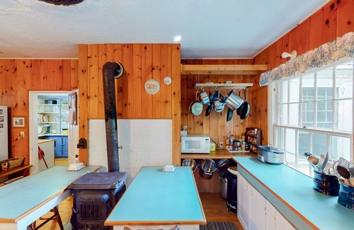 Charlotte Cottage | Century-old lakefront Victorian on a private island with boats & beach - dogs OK