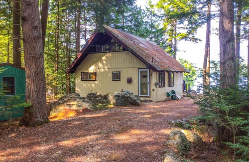 Meredith Cottage | Chalet-style lakefront home with private dock, beach, kayak, canoe & epic view
