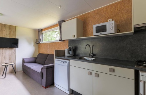 Vessem Ski Chalet | chalet with covered terrace on campsite with pool