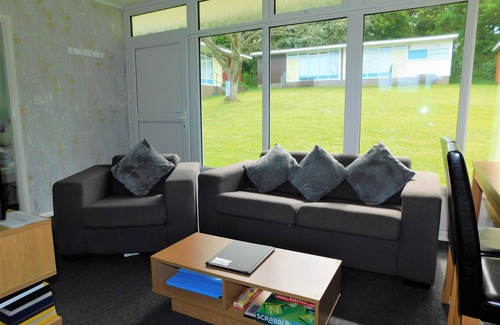 Cromer Ski Chalet | Chalet with open planned kitchen/living area, benefiting from direct access to fantastic cliff walks