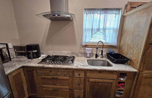 Yantis Cottage | Charming 1b/1b mother in law unit sits on 12 ac on NE side of Lake Fork .