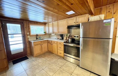 Rapid City Cabin | Charming cabin with lake access and kayaks! Boat slip included - see details