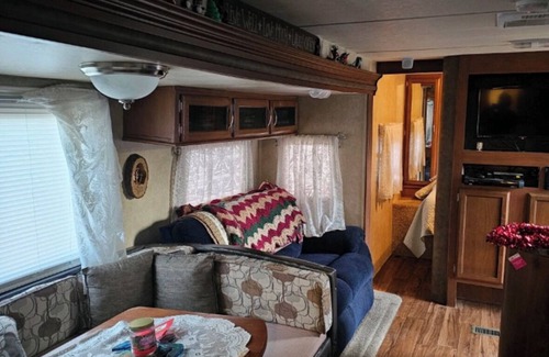 Greenbush RV Rental | Charming camper within Trails End ChinoteagueBay Resort in Horntown VA