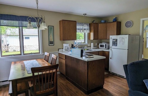 Northport House | Charming cottage with shared beachfront on Grand Traverse Bay near Northport.