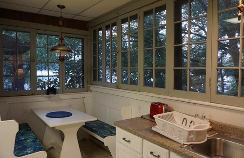 Burdett Cottage | Charming lakefront cottage with private beach and boat dock.