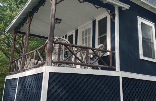 Burdett Cottage | Charming lakefront cottage with private beach and boat dock.