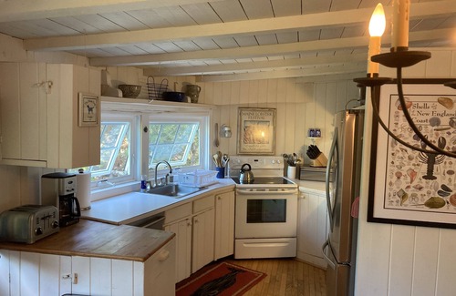 Owls Head Cottage | Charming Sapphire Blue Owls Head Waterfront Cottage