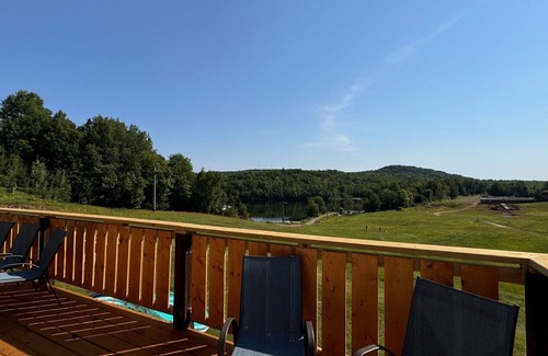 Upson Ski Chalet | Charming, ski-in, ski-out, lake-view chalet w/10 bedrooms, kitchen and AC.