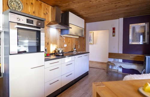 Valsot Apartment | Chasa Patgific: Cozy 3-Room Holiday Apartment with Wood Stove and Stunning Garden in Ramosch