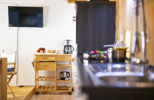 Valsot Apartment | Chasa Patgific: Cozy 3-Room Holiday Apartment with Wood Stove and Stunning Garden in Ramosch