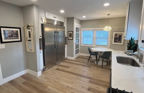 Como House | Chef's Kitchen and Hot Tub at Nymph's Haven