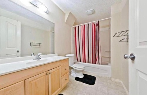 Chestermere House | Chestermere room with King sized bed