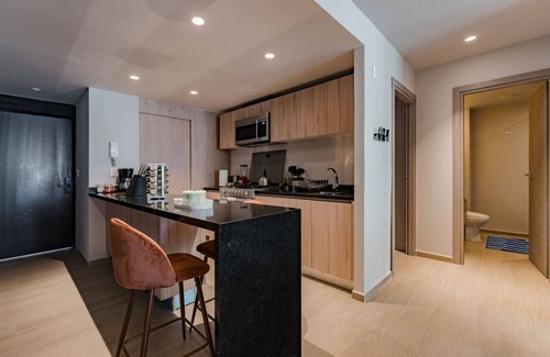 Del Valle Apartment | Chic Apartment with Tree-Lined Balcony Views & Parking