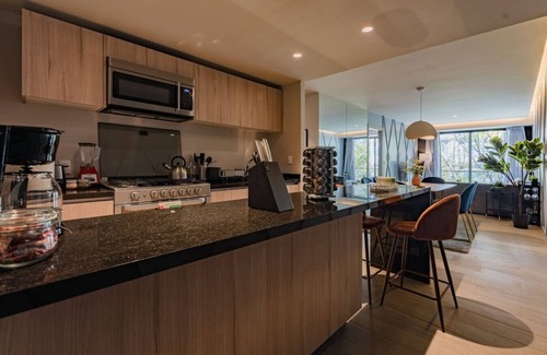 Del Valle Apartment | Chic Apartment with Tree-Lined Balcony Views & Parking