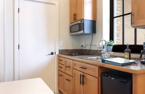 Traverse City Condo | Chic Studio in Historic Village~Walk to Restaurants, Shops, and Trails!