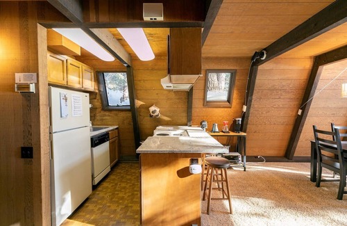 Truckee Cabin | Classic Tahoe a-frame cabin forest view floor2ceiling window. Near Northstarn