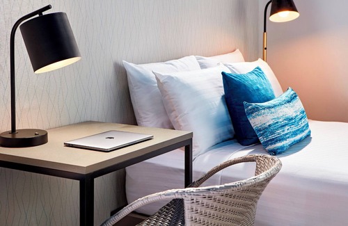 North Pacific Beach Hotel | Coastal Retreat: Modern Room Brimming with Ocean Ambiance