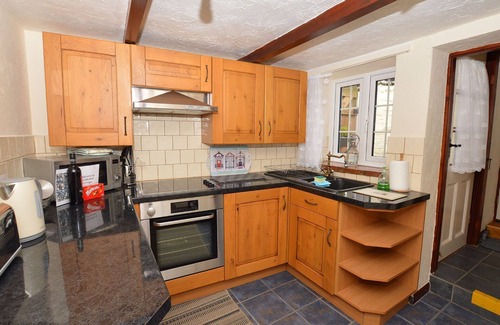 Sheringham Cottage | Cockleshell Cottage - superb, traditional flint cottage in an enviable position yards from the sea.