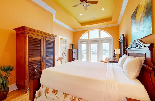 Sunset Pass House | Colorful end unit townhome with resort amenities, sound views, W/D, & AC