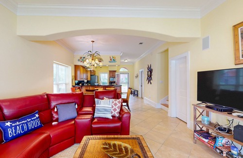 Sunset Pass House | Colorful end unit townhome with resort amenities, sound views, W/D, & AC