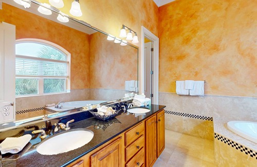 Sunset Pass House | Colorful end unit townhome with resort amenities, sound views, W/D, & AC