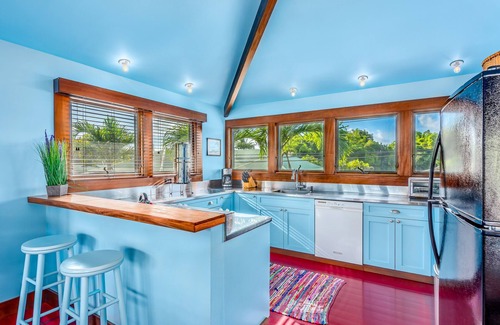 Hanalei House | Colorful home with Hanalei waterfall & mountain views, & AC in bedrooms